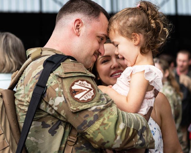 soldier holding child
